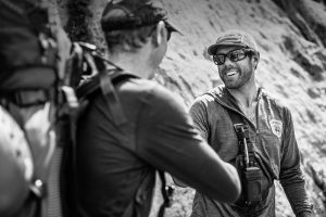 Climber shakes a ranger's hand on Mt. Rainier