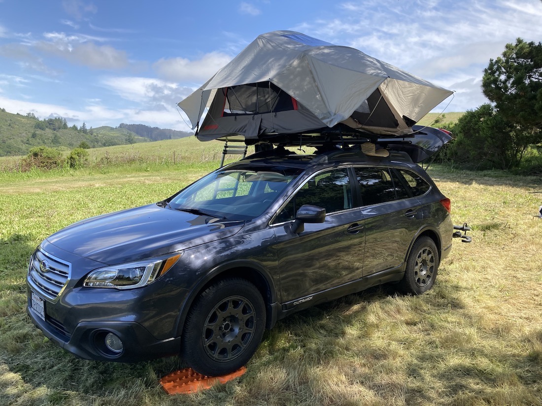 Subaru Outback with a rooftop tent