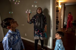 Afghan family in their new apartment